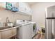 Laundry room with washer, dryer, and utility sink at 4551 Day Lily Run St., Myrtle Beach, SC 29579