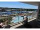 Balcony with seating and resort pool and marina views at 4801 Harbor Pointe Dr. # 802, North Myrtle Beach, SC 29582