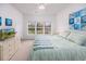 Main bedroom with king-size bed, large windows, and a ceiling fan at 5804 Longwood Dr. # 301, Murrells Inlet, SC 29576