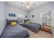 Bright bedroom with two twin beds, nightstands, and ample natural light at 5804 Longwood Dr. # 301, Murrells Inlet, SC 29576
