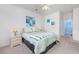 Cozy bedroom with a full-size bed, large windows, and a ceiling fan at 5804 Longwood Dr. # 301, Murrells Inlet, SC 29576