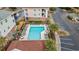 Aerial view of community pool with surrounding patio furniture at 5750 Oyster Catcher Dr. # 414, North Myrtle Beach, SC 29582