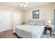 King sized bed in bright bedroom with double doors at 5750 Oyster Catcher Dr. # 414, North Myrtle Beach, SC 29582