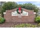 Attractive brick Cypress Bend community entrance with holiday wreath at 5750 Oyster Catcher Dr. # 414, North Myrtle Beach, SC 29582