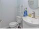 Small bathroom with toilet, sink, and a white shelf at 6001- Mh182 S Kings Hwy., Myrtle Beach, SC 29575