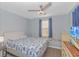 Bedroom with window seat, TV, and coastal bedding at 6001- Mh182 S Kings Hwy., Myrtle Beach, SC 29575