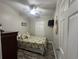 Cozy bedroom with a queen-size bed and wood-look floors at 6001-1886 S Kings Hwy., Myrtle Beach, SC 29575