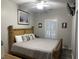 Main bedroom with bamboo bed frame and ocean art at 6001-1886 S Kings Hwy., Myrtle Beach, SC 29575