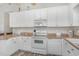 White kitchen with ample counter space and appliances at 6001-1886 S Kings Hwy., Myrtle Beach, SC 29575