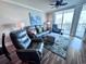 Spacious living room with comfortable seating and hardwood floors at 603 S Ocean Blvd. # 1002, North Myrtle Beach, SC 29582