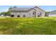 House exterior and grassy backyard at 612 Pine Oaks Farm Rd., Aynor, SC 29511