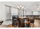 Bright dining area with table and chairs, and a view into the living room at 612 Pine Oaks Farm Rd., Aynor, SC 29511