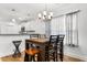 Small dining area with a four-chair table and a view of the kitchen at 612 Pine Oaks Farm Rd., Aynor, SC 29511