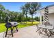 Spacious backyard patio with grill and seating at 612 Pine Oaks Farm Rd., Aynor, SC 29511