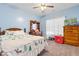 Cozy bedroom with wooden dresser, full bed, and Christmas bedding at 971 Mcnabb Rd., Loris, SC 29569