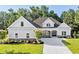 Craftsman style home with gray siding, stone accents, and a three-car garage at 1017 Muscovy Pl., Conway, SC 29526