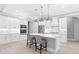 Modern kitchen with white cabinets, quartz countertops, and stainless steel appliances at 1017 Muscovy Pl., Conway, SC 29526