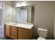 Bathroom features wood vanity, large mirror and toilet at 1168 Great Lakes Circle, Myrtle Beach, SC 29588