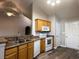 Kitchen features wood cabinets, a built-in microwave and ample counter space at 1168 Great Lakes Circle, Myrtle Beach, SC 29588