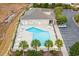 Community pool and adjacent bathhouse with parking area at 1276 Marsilio Ln Sw, Ocean Isle Beach, NC 28469