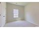 Simple bedroom with neutral walls and carpet at 1347 Palm Springs Paloma Dr, Longs, SC 29568