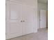 Double door closet with light neutral walls at 1347 Palm Springs Paloma Dr, Longs, SC 29568