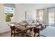 Bright dining area with wooden table and chairs, adjacent to living room at 142 Talladega Dr. # 534, Myrtle Beach, SC 29579