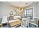 Elegant dining room featuring a rustic wooden table and chandelier at 2241 Waterview Dr. # 326, North Myrtle Beach, SC 29582