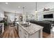 Modern kitchen with white cabinets, granite island, and stainless steel appliances at 244 Splendor Circle, Murrells Inlet, SC 29576