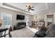 Living room with sectional sofa, fireplace, and access to upper level at 244 Splendor Circle, Murrells Inlet, SC 29576