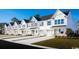 Row of charming townhouses with white exteriors and green accents at 317 Bent Green Ct. # 84B, Murrells Inlet, SC 29576