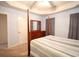 Main bedroom with wood post bed and light blue walls at 4530 Lighthouse Dr. # 31-C, Little River, SC 29566