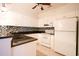 Kitchen with white cabinets, granite countertops and tile backsplash at 4530 Lighthouse Dr. # 31-C, Little River, SC 29566