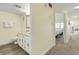 Bathroom with granite countertop, white vanity, and updated flooring at 4800 S Ocean Blvd. # 920, North Myrtle Beach, SC 29582