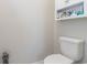 Clean and simple bathroom with a toilet and wall-mounted storage at 5037 Sassari St., Myrtle Beach, SC 29579