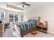 Main bedroom with a large bed, window seating, and plenty of natural light at 5037 Sassari St., Myrtle Beach, SC 29579