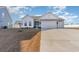 Two-story Craftsman home with gray siding, white accents, and a two-car garage at 5037 Sassari St., Myrtle Beach, SC 29579