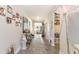Long hallway with hardwood floors, wall art, and decorative accents at 5037 Sassari St., Myrtle Beach, SC 29579