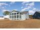 Charming house with sunroom, grassy backyard, and neighborhood view at 5037 Sassari St., Myrtle Beach, SC 29579