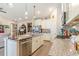 Modern kitchen island with granite countertops and stainless steel appliances at 5037 Sassari St., Myrtle Beach, SC 29579