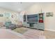 Living room with vaulted ceiling, comfortable seating, and built-in shelving at 5037 Sassari St., Myrtle Beach, SC 29579