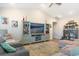 Living room with vaulted ceiling, comfortable seating, and built-in shelving at 5037 Sassari St., Myrtle Beach, SC 29579