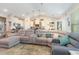 Open living area with sectional sofa, and view into kitchen at 5037 Sassari St., Myrtle Beach, SC 29579