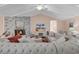 Light-filled living room with sectional sofa, fireplace, and hardwood floors at 512 N Myrtle Dr., Surfside Beach, SC 29575