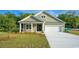 Charming one-story house with a front porch and landscaped lawn at 570 Haven View Way, Murrells Inlet, SC 29576