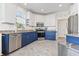 Modern kitchen with blue cabinets, granite counters, and stainless steel appliances at 8201 Caddis Ct., Myrtle Beach, SC 29579