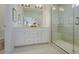 Modern bathroom with a walk-in shower and white cabinets at 8465 Waltzing Waves Ct. # 26, Myrtle Beach, SC 29572