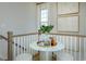 Small landing area with a marble table and chairs at 8465 Waltzing Waves Ct. # 26, Myrtle Beach, SC 29572
