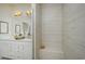 Clean shower with tiled walls and built-in seat at 8465 Waltzing Waves Ct. # 26, Myrtle Beach, SC 29572