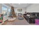 Living room with brown couch, Christmas tree, and wood flooring at 931 Green Side Dr., Myrtle Beach, SC 29588